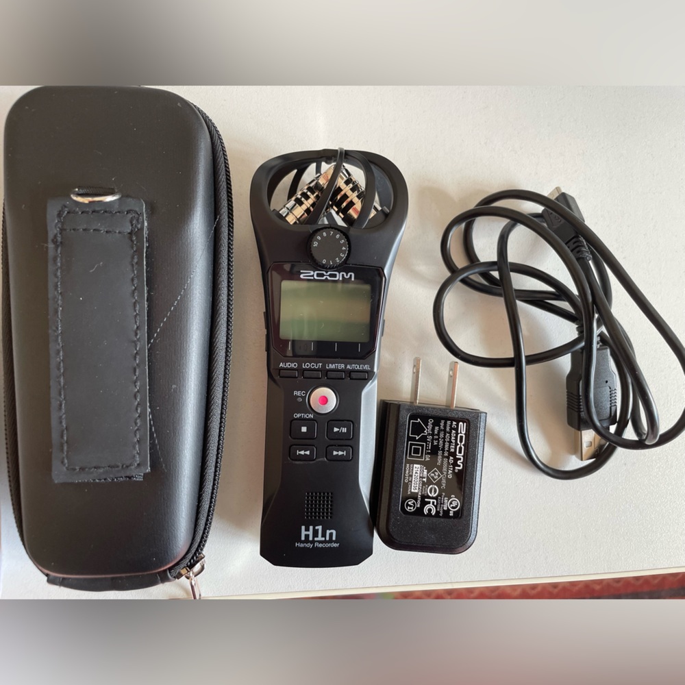 Zoom H1n recorder and case.